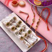 Pista Roll With Two Golden Rakhis: Set of 2 rakhi with sweets