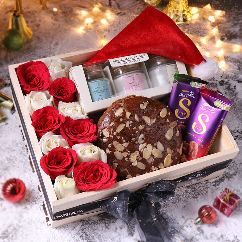 Plum Cake With Roses Candles Chocolates N Santa Cap