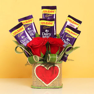 Chocolates and Roses in a Glass Vase
