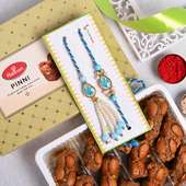 Order Lumba Rakhi for Bhaiya bhabhi with Sweets - Punjabi Pinni With Bhaiya Bhabhi Studded Rakhis