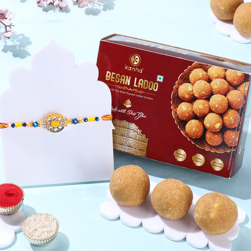 Radiant Floral Stone Rakhi With Besan Ladoos