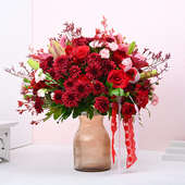Radiant Red Floral Elegance In Brown Vase