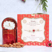 Rakhi Card N Almonds Combo - One Designer Rakhi with Card with Complimentary Roli and Chawal and 100gm Almonds in Red Floweraura Container