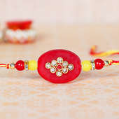 Side View of Set of Two Red Rakhis with 500gm Besan Barfi and 250gm Cashews For Bhaiya Bhabhi