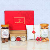 Red Floral Rakhi With Cookies - One Designer Rakhi with Roli and Chawal and Chocolate Cookies and Coconut Cookies and One Floweraura Signature Box