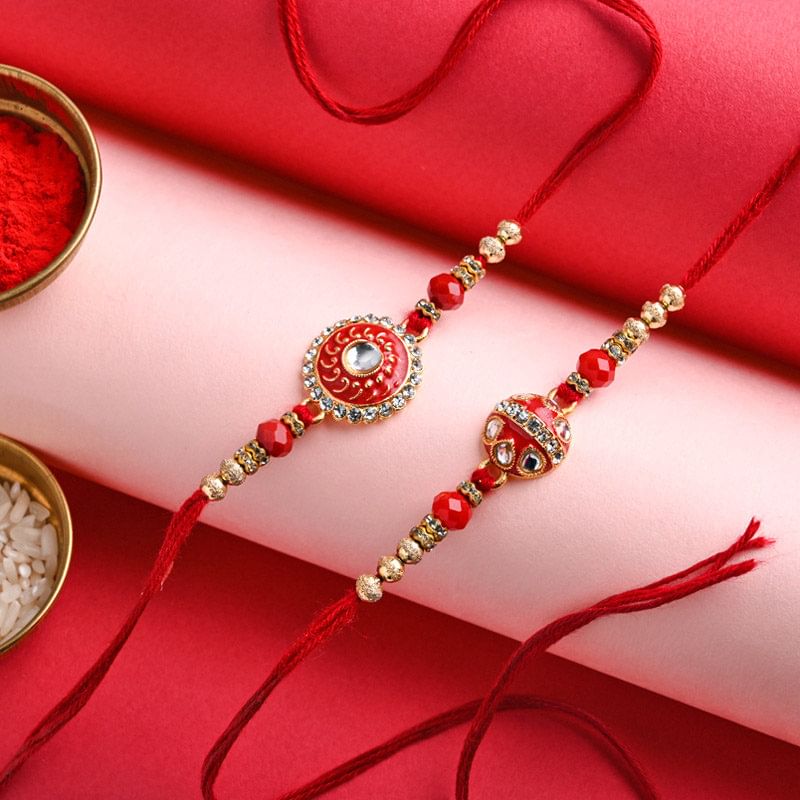 Red N Gold Stones Engraved Rakhi Duo: Set of 2 Designer Rakhi 