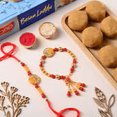 Red N Yellow Bhaiya Bhabhi Rakhis With Laddu