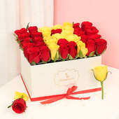 Red and Yellow Roses in a White Box