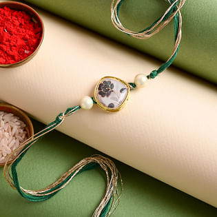 Online Rakhi in India - Resham Flower Charm Rakhi