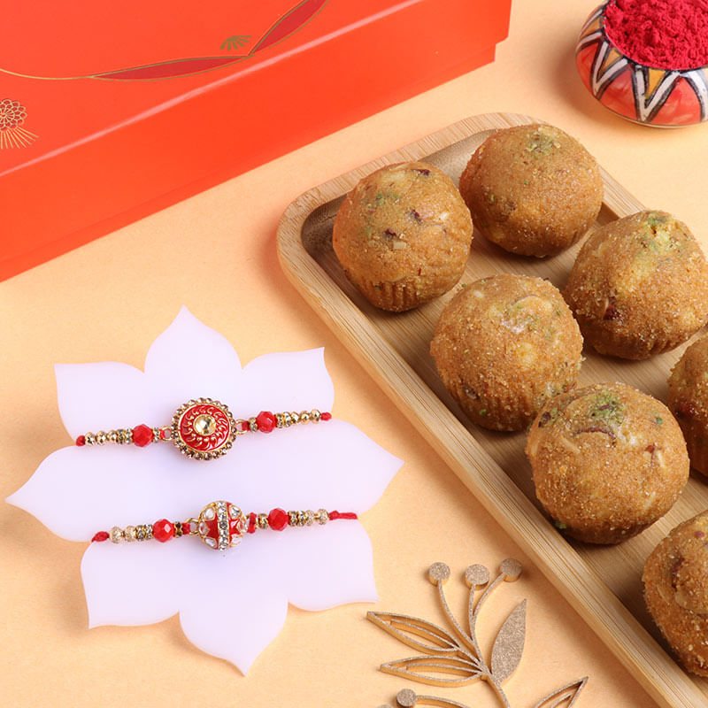 Set of 2 Radiant Red Rakhi With Besan Ladoo