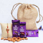 Rich Metallic Rakhi Hamper - One Metal Rakhi with Complimentary Roli and Chawal and 100gm Almonds in Jute Potli and 3 Dairy Milk Chocolates - 13gm each