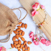 Rose Lumba Rakhi N Nut Combo - Set of Bhaiya Designer Rakhi with Complimentary Roli and Chawal and 100gm Almonds in Jute Potli