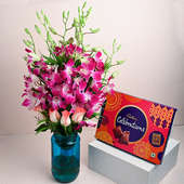 Roses N Orchids In Blue Vase With Chocolates