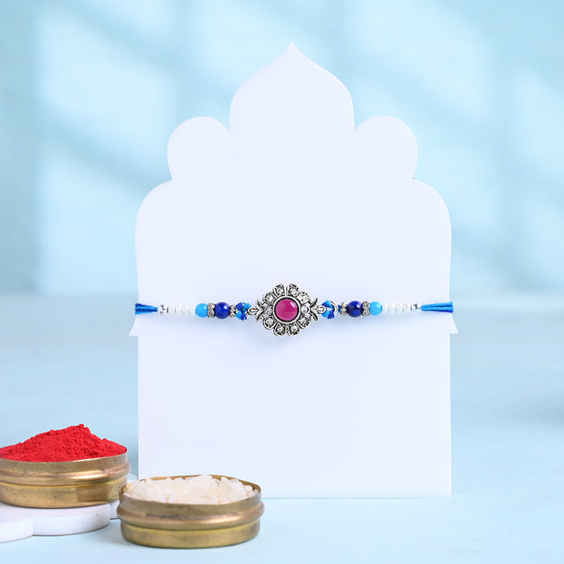 Ruby Designer Rakhi With Besan Ladoos