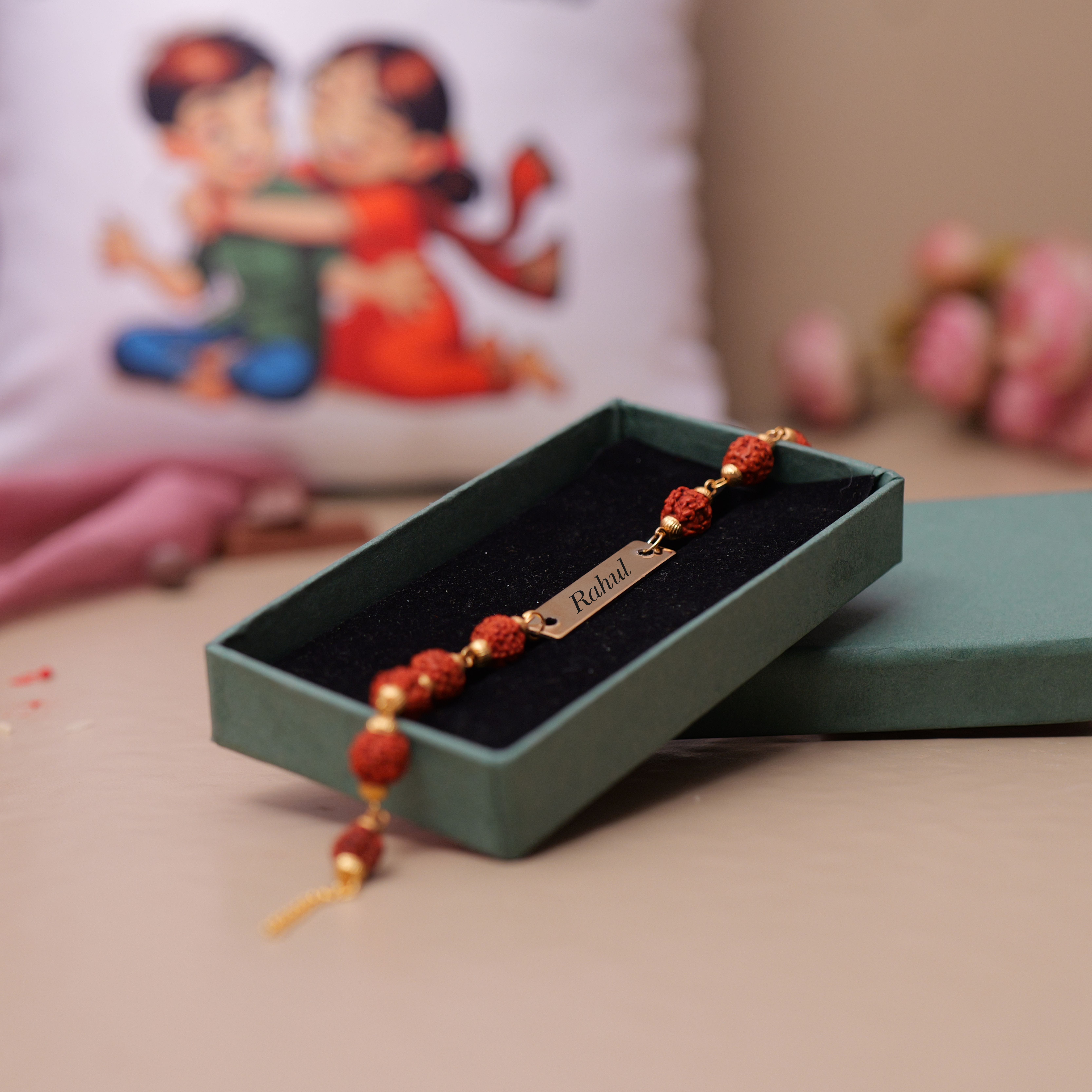 Rudraksha Metal Rakhi With Love In Fights Pillow