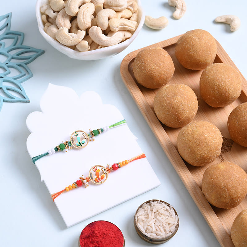 Sacred Ganesha Rakhi Duo With Ladoos N Nuts