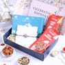 Sacred Ganesha Rakhi with Sweets and Premium Nuts