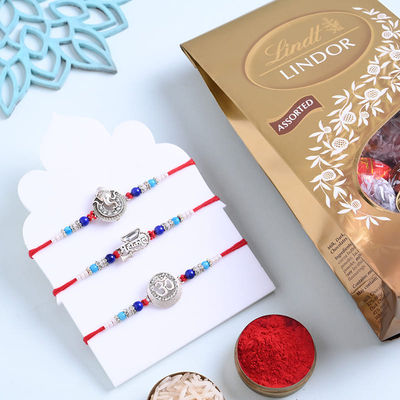 Sacred Silver Rakhi Trio With Lindt Lindor