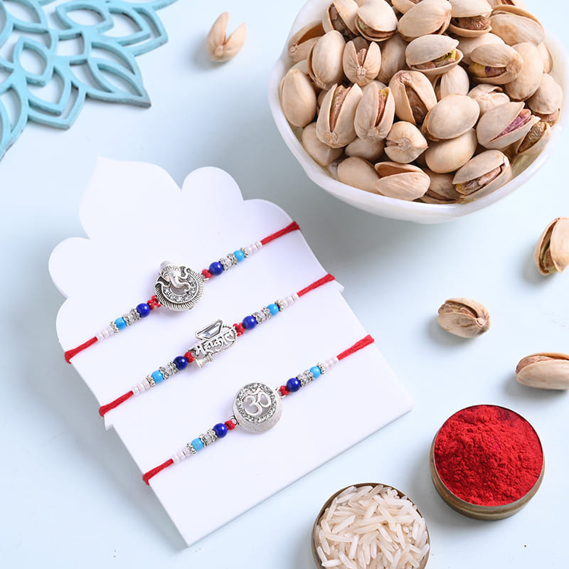 Sacred Silver Rakhi Trio With Pistachios