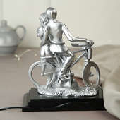 Satiny Couple On Bicycle Showpiece Gift Item