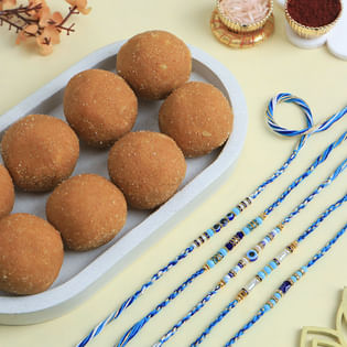 Set Of Five Evil Eye Rakhis With Besan Ladoos