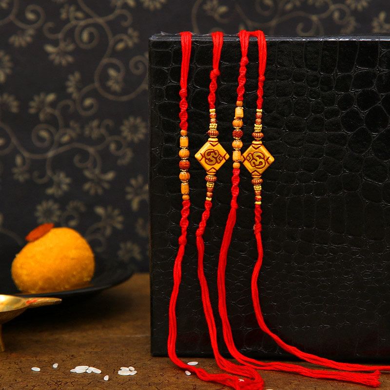 Set Of 4 Om N Rudraksha Rakhis with Complimentary Roli Chawal