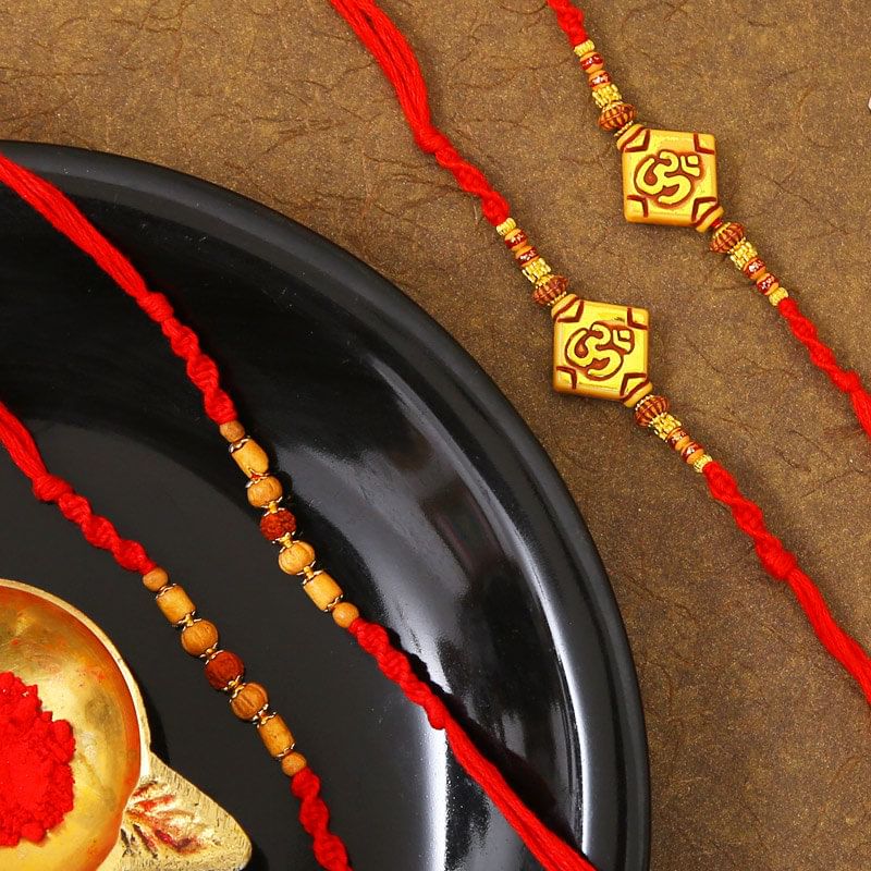 Set Of 4 Om N Rudraksha Rakhis with Complimentary Roli Chawal