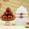 Golden Ganesha Rakhi With Laddoos