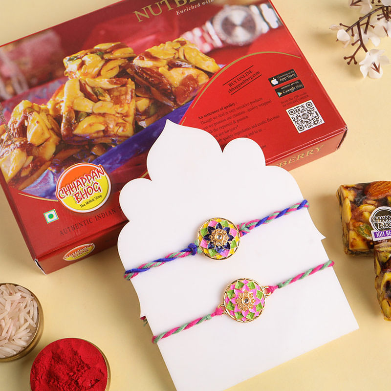 Set Of Two Floral Motif Rakhis With Nutty Sweets
