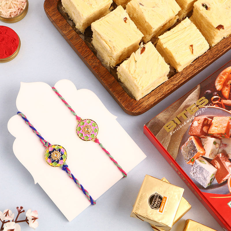 Set Of Two Floral Rakhis With Sweets