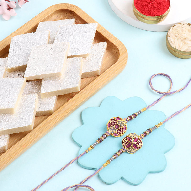 Set Of Two Purple Floral Rakhi With Kaju Katli-UAE
