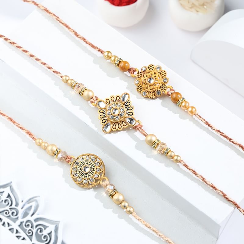 Shimmering Peach N Gold Rakhi Trio