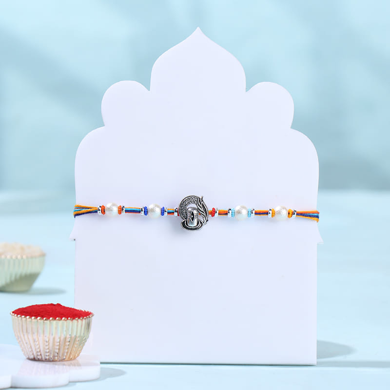 Shivling Pearls Rakhi With Chocolate Bar