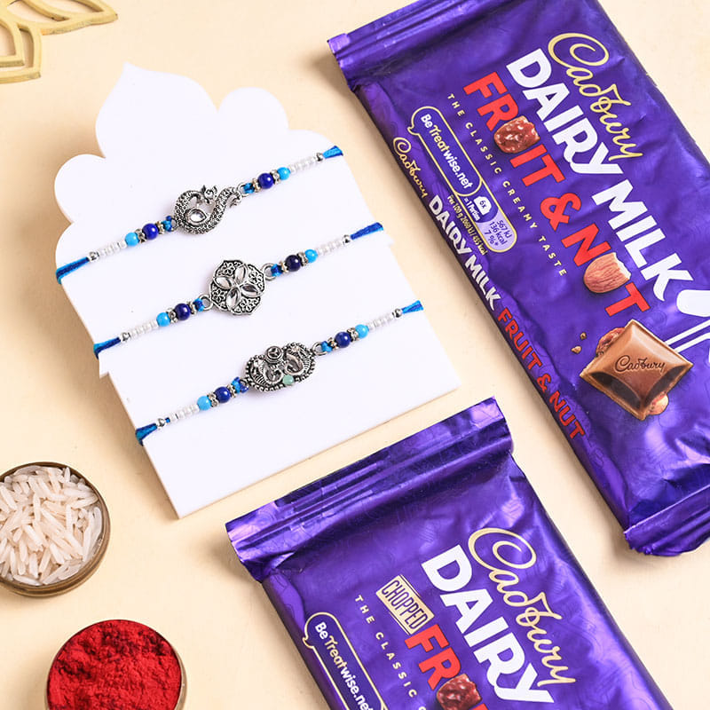 Three Silver Charm Rakhis With Cadbury Bars