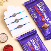 Three Silver Charm Rakhis With Cadbury Bars