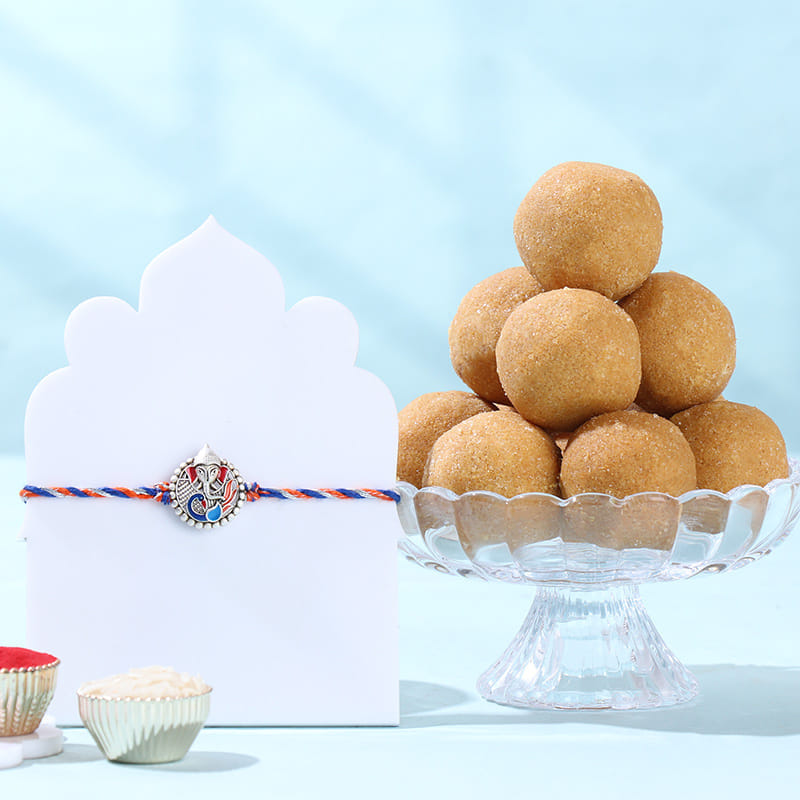 Silver Ganehsa Rakhi With Gourmet Snacks