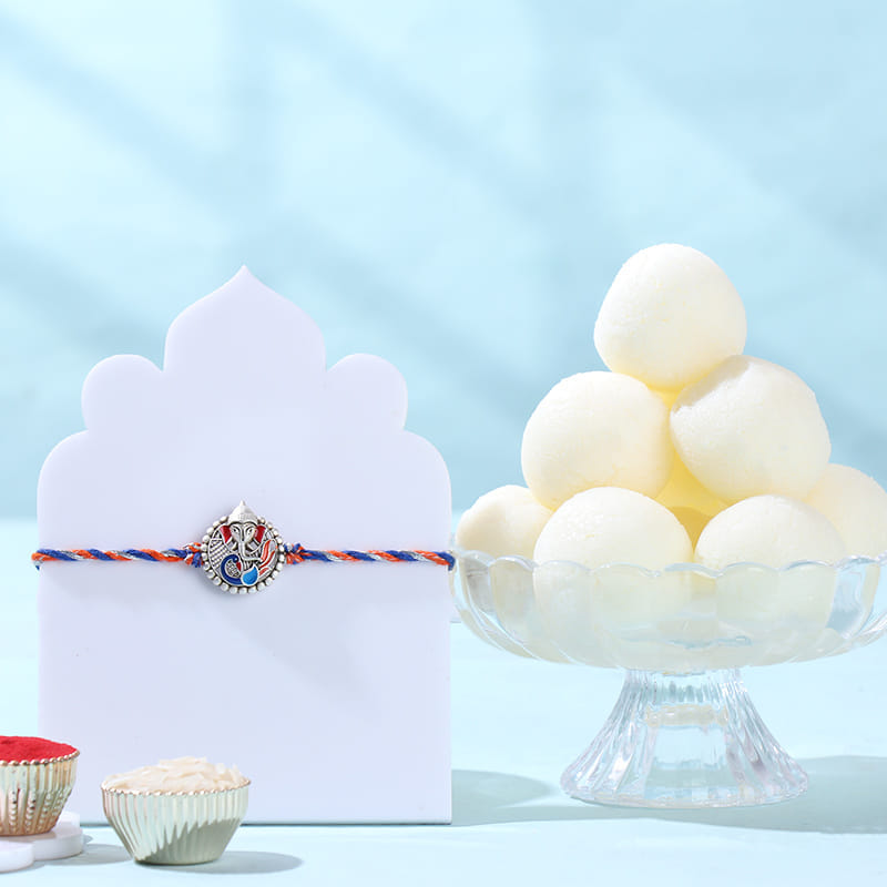 Silver Ganesha Rakhi With Rasgullas