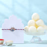 Silver Ganesha Rakhi With Rasgullas