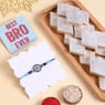 Send Sparkling Blue Floral Rakhi With Kaju Katli to USA Online