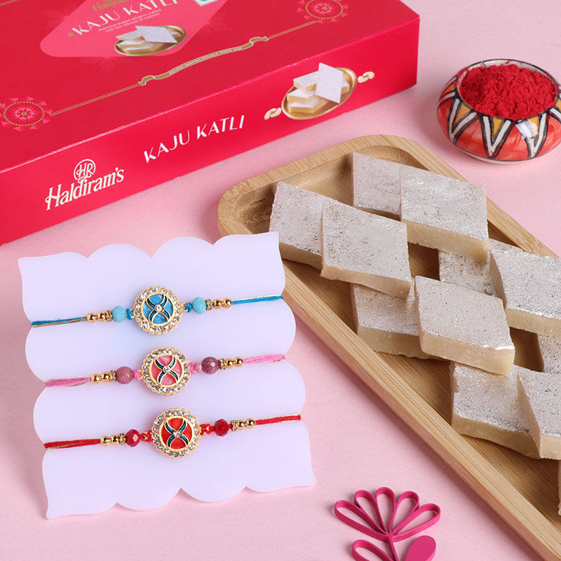 Gleaming Rakhi Trio N Haldirams Kaju Katli