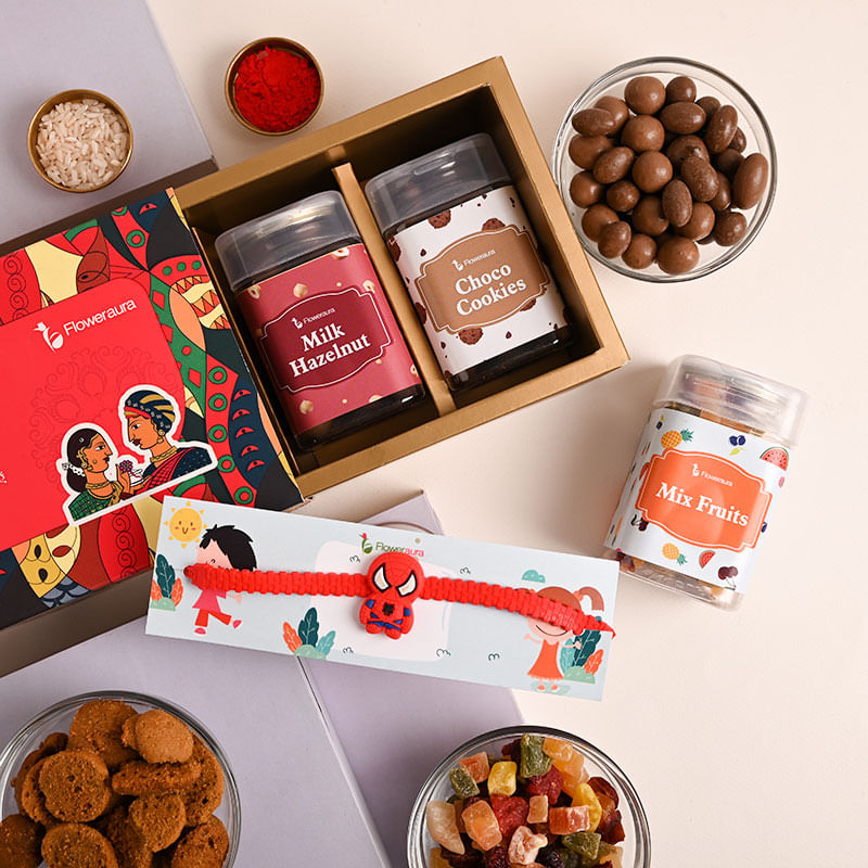 Send kids With Dry Fruits For Kids Online - Cute Spiderman Rakhi Hamper Featuring Choco Cookies Milk Hazelnut Mix Fruits