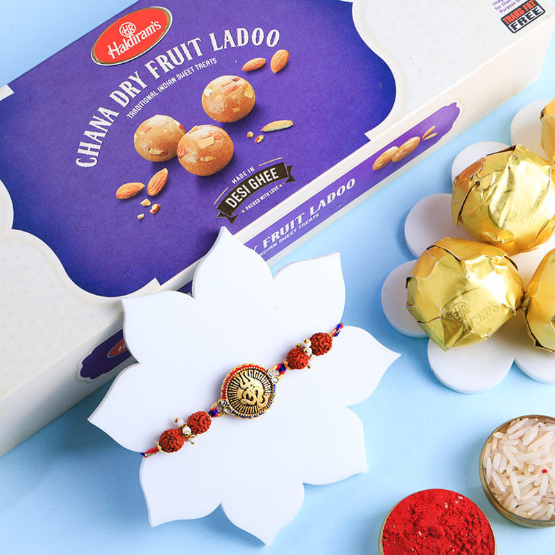 Spiritual Charm Om Rakhi With Sweets