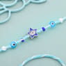 Blue Evil Eye Rakhi with White Beads for Brother