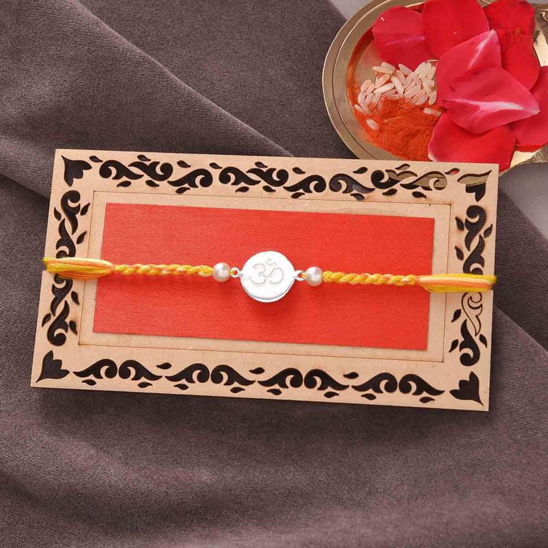 Top View of Sterling Om Charm Rakhi - A Silver Rakhi