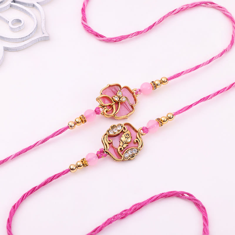 Stone Studded Floral Rakhi Duo With Sweet Treats