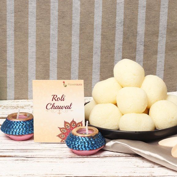 Diwali Puja Essentials - 1 Kg Haldiram Rasgulla with 2 Designer Diyas and Complementary Roli Chawal