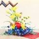 12 Yellow Carnations 10 Purple Orchids and 3 Yellow Lilies