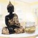 Golden buddha god idol with aroma candle