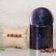 Choco Rudraksha Rakhi Combo - One Rudraksh Rakhi with Complimentary Roli and Chawal and 100gm Choco Raisins in Metallic Container