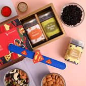 Send kids With Dry Fruits For Kids Online - Superman Rakhi Hamper Featuring Almonds Dried Black Currant And A Healthy Mix 